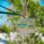 Queenslander Earring - Toowong. Hung on mini Hills Hoist with nature background