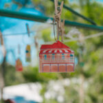 Queenslander Earring - Woodend. Hung on mini Hills Hoist with nature background